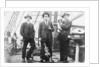 Second Officer, Captain H.J. Bray (with dog Ollie) and Chief Officer standing on deck, at Tacoma, USA by unknown