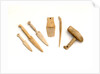 Ivory model of a snow knife, awl, comb by unknown