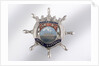 Enamelled metal brooch by unknown
