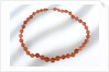 Amber beads by unknown