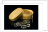 Nine lenses of various sizes in a box by Unknown