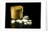 Pill box containing eight chalky white plaster-like crystals by unknown