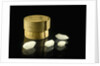 Pill box containing four cloudy white crystals by Unknown