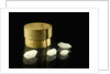 Pill box containing four cloudy white crystals by Unknown