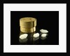 Pill box containing four cloudy white crystals by Unknown
