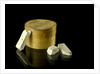 Pill box containing eight chalky plaster like crystals by unknown