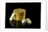 Pill box containing eight chalky plaster like crystals by unknown