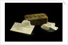 A tobacco tin containing pieces of quartz. by Unknown
