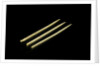 Three paper 'cocktail sticks', one still has a needle in it by unknown