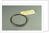 Roll of brass wire in a bag by unknown