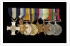 Medals awarded to Cdr J. L. Younghusband DSC (obverse, l to r, MED1228-1235) by Garrard & Co.