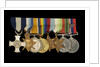 Medals awarded to Cdr J. L. Younghusband DSC (obverse, l to r, MED1228-1235) by Garrard & Co.
