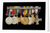 Medals awarded to Cdr J. L. Younghusband DSC (reverse, r to l, MED1228-1235) by Garrard & Co.