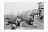 Newlyn Harbour, Cornwall. The old harbour with fishermen looking out to sea. by Francis Frith & Co.