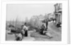 Newlyn Harbour, Cornwall. The old harbour with fishermen looking out to sea. by Francis Frith & Co.