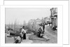 Newlyn Harbour, Cornwall. The old harbour with fishermen looking out to sea. by Francis Frith & Co.
