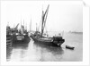 The 'Olive May' (1920), a port quarter view of the barge motoring to quayside with her tender in tow (sails furled) by Anonymous