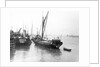The 'Olive May' (1920), a port quarter view of the barge motoring to quayside with her tender in tow (sails furled) by Anonymous