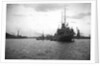 HMS 'Titania' (1915) submarine depot ship, moored at Portland with 4 submarines alongside by unknown