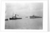 Rescue tug HMS 'Vanquisher' (1899) entering the floating dock at Harwich with the mined destroyer 'Thisbe' (1917) in tow by unknown