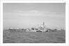 Aircraft carrier HMS 'Illustrious' (1939) in June 1953, anchored in Line F at Spithead for the Coronation Review. The aircraft lighter 'R.N.AIR' is alongside by unknown
