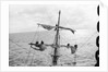 Aloft on the Mizzen furling the blown-out sails by Alan Villiers