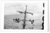 Aloft on the Mizzen furling the blown-out sails by Alan Villiers