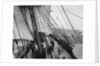 Unbending a topsail by Alan Villiers