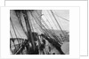 Unbending a topsail by Alan Villiers