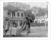 Two Chinese men carrying a load suspended from a pole between them by Kenneth Hurlstone Jones