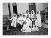 A Kuwaiti merchant at home with his family by Alan Villiers