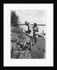A British government official checking mangrove poles by Alan Villiers