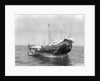 A baggala at anchor off Zanzibar discharging her cargo by Alan Villiers