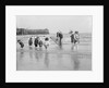 Boys and girls watch intently as a local fisherman wields his net in Scarborough, Yorkshire by Samuel Coupe Fox