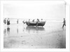 Five fishermen carrying a Sheringham crab boat up the beach, assisted by three boys, at Lowestoft by Smiths Suitall Ltd.