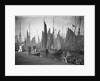 A view from the wooden quay at Lowestoft, Suffolk, looking across the trawl basin filled with a large number of sailing trawlers by Smiths Suitall Ltd.