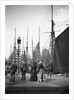 Men and women onlookers at the end of the quay looking at the forest of masts and sails in the harbour at Lowestoft, Suffolk by Smiths Suitall Ltd.