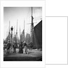 Men and women onlookers at the end of the quay looking at the forest of masts and sails in the harbour at Lowestoft, Suffolk by Smiths Suitall Ltd.