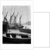 The Thames at low water with various crafts beached on the Southbank and Tower Bridge in the background. by Eagar