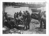 Folkestone, Kent. Sorting fish on the harbour slipway at low water by unknown