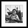 A portrait of a young girl in a sampan in Aberdeen harbour, Hong Kong. by David Watkin Waters