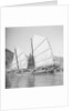 An Aberdeen fisher type junk under sail in Hong Kong harbour. by David Watkin Waters