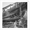 A close port side view of a Hong Kong fisher d.w. type junk repairing on a slipway at Hong Kong by David Watkin Waters