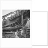 A close port side view of a Hong Kong fisher d.w. type junk repairing on a slipway at Hong Kong by David Watkin Waters