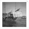 A port quarter view of an Aberdeen frame stern fisher type junk in Hong Kong harbour by David Watkin Waters