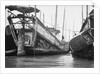 A starboard quarter view of an Hangchow Bay trader type junk moored with other junks at Shanghai by David Watkin Waters