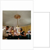 Passengers in smart evening dress, aboard an unspecified cruise liner, enjoy the thrilling distraction of a card game by Marine Photo Service