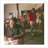 Passengers on board an unspecified cruiser liner pass the time by writing and walking the ship by Marine Photo Service