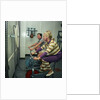 After all the lunches and cocktail evenings, a little exercise is just the thing: two passengers use exercise bikes in the gym of an unspecified cruise liner by Marine Photo Service