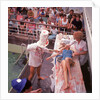 Macabre comic entertainment aboard an unspecified cruise ship, with a female passenger prostrate on a bloody slab - perhaps a variant of the Crossing the Line (the Equator) ceremony? by Marine Photo Service